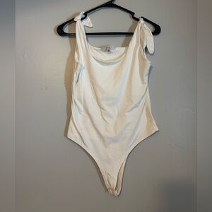 woman’s white body suit